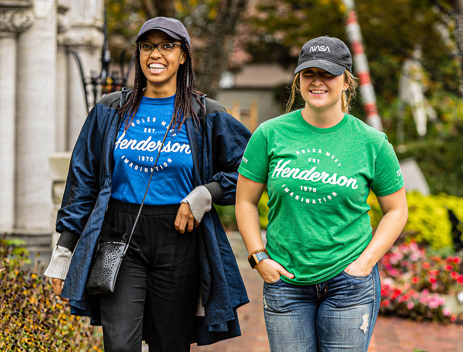 Two Henderson employees working at a community service job site for charity.