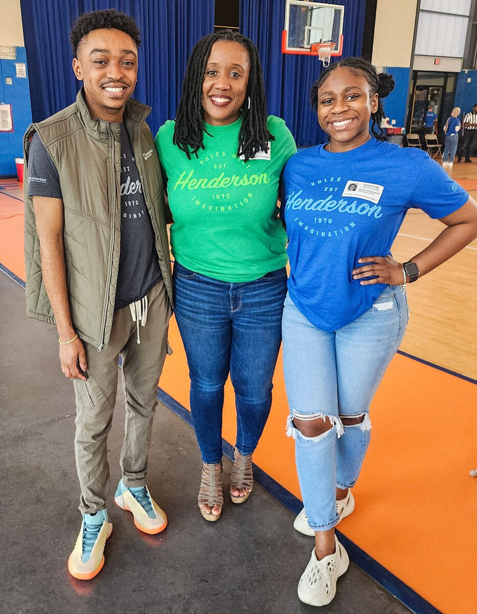 Three Henderson employees giving back at a junior engineering day.