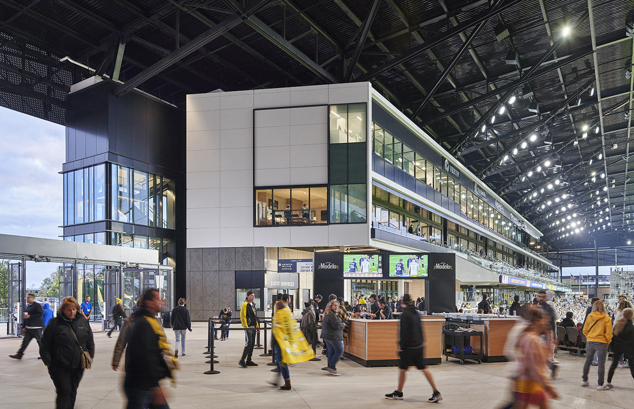 Soccer fans walking around near concessions at Lower.com Field