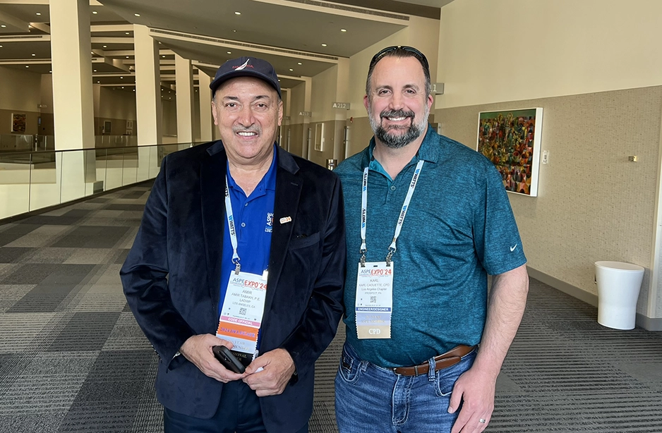 Henderson employee at a conference with a client